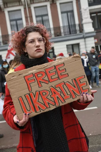 Sophia Bulgakova at a protest in The Hague, photo by Christopher Pugmire, January 2022