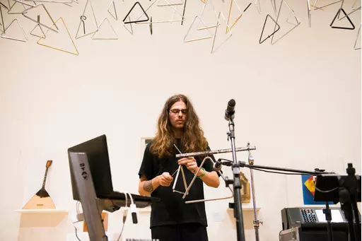 Joaquim Emídio performing a piece for solo triangle at my installation “Ode to Triangle” at Pinacoteca de São Paulo, 2019.